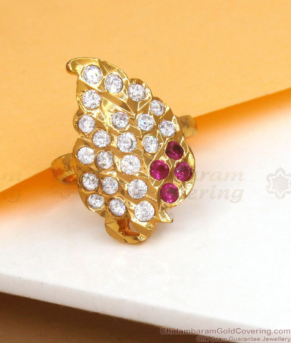 Princes diana ring with Created ruby. center stone acented with CZ on the  sides.